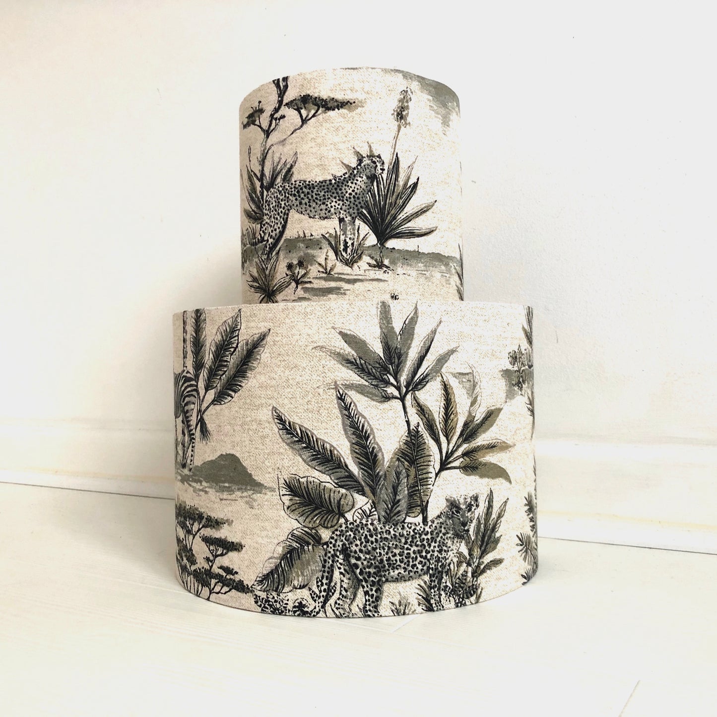 African safari-themed lampshade with vibrant animal and landscape motifs, perfect for adding a touch of exotic style and warmth to home decor.