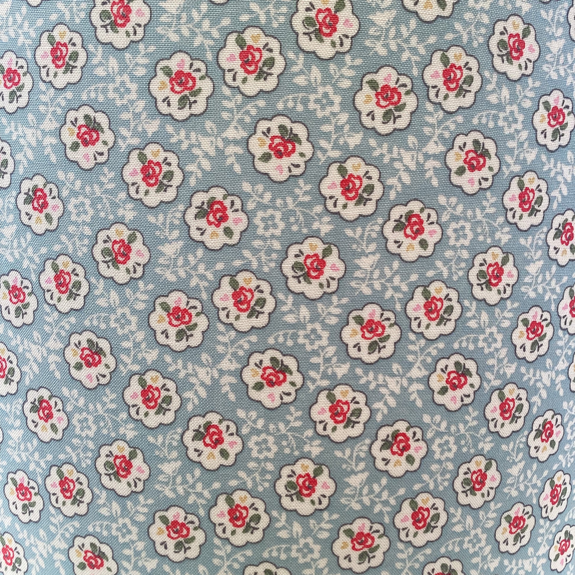 Blue Provence Rose lampshade with a soft, floral design in shades of blue and white, adding a touch of elegance and charm to any room.