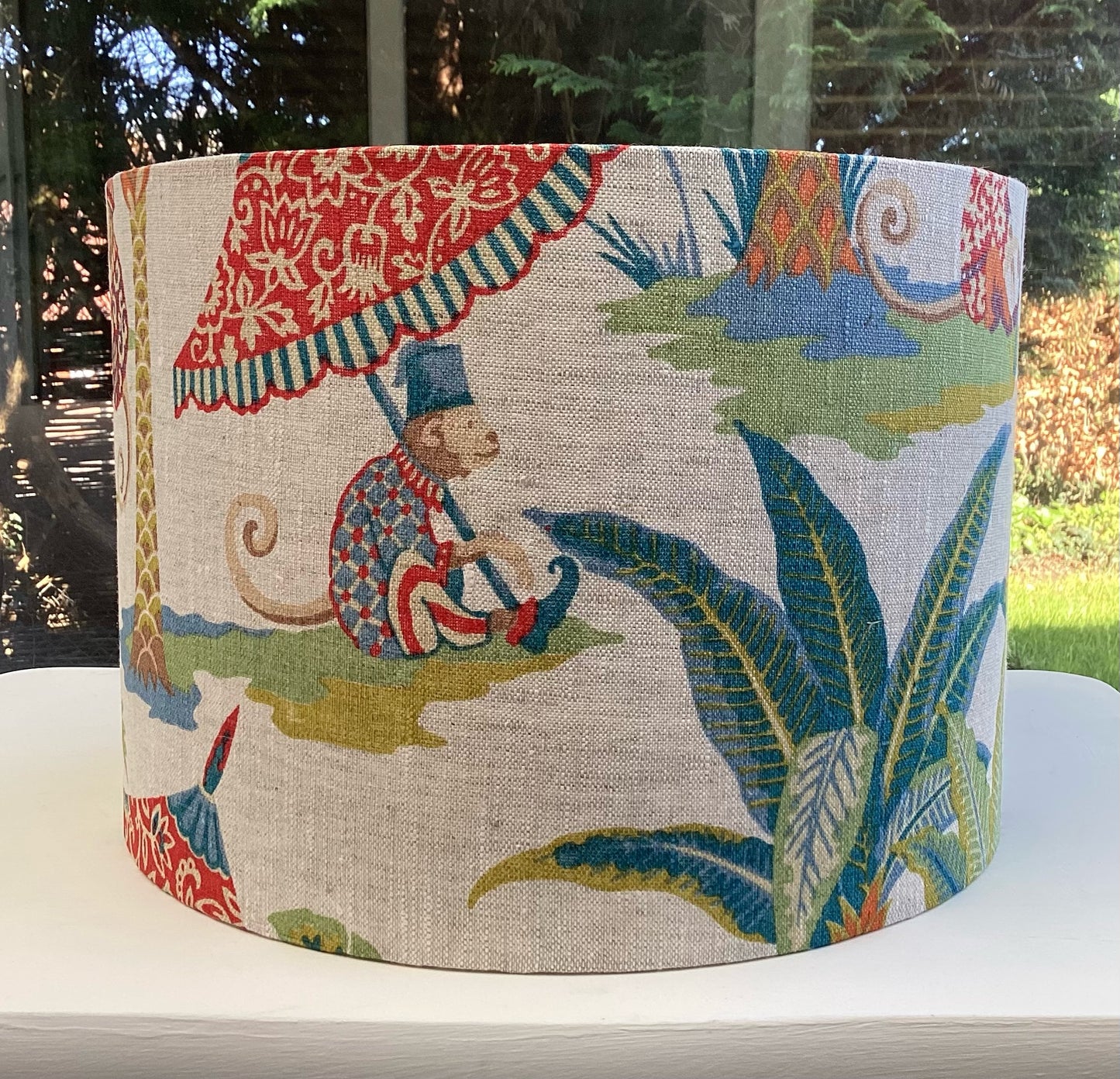 A playful lampshade featuring a cheerful monkey motif, perfect for adding whimsy to any space.