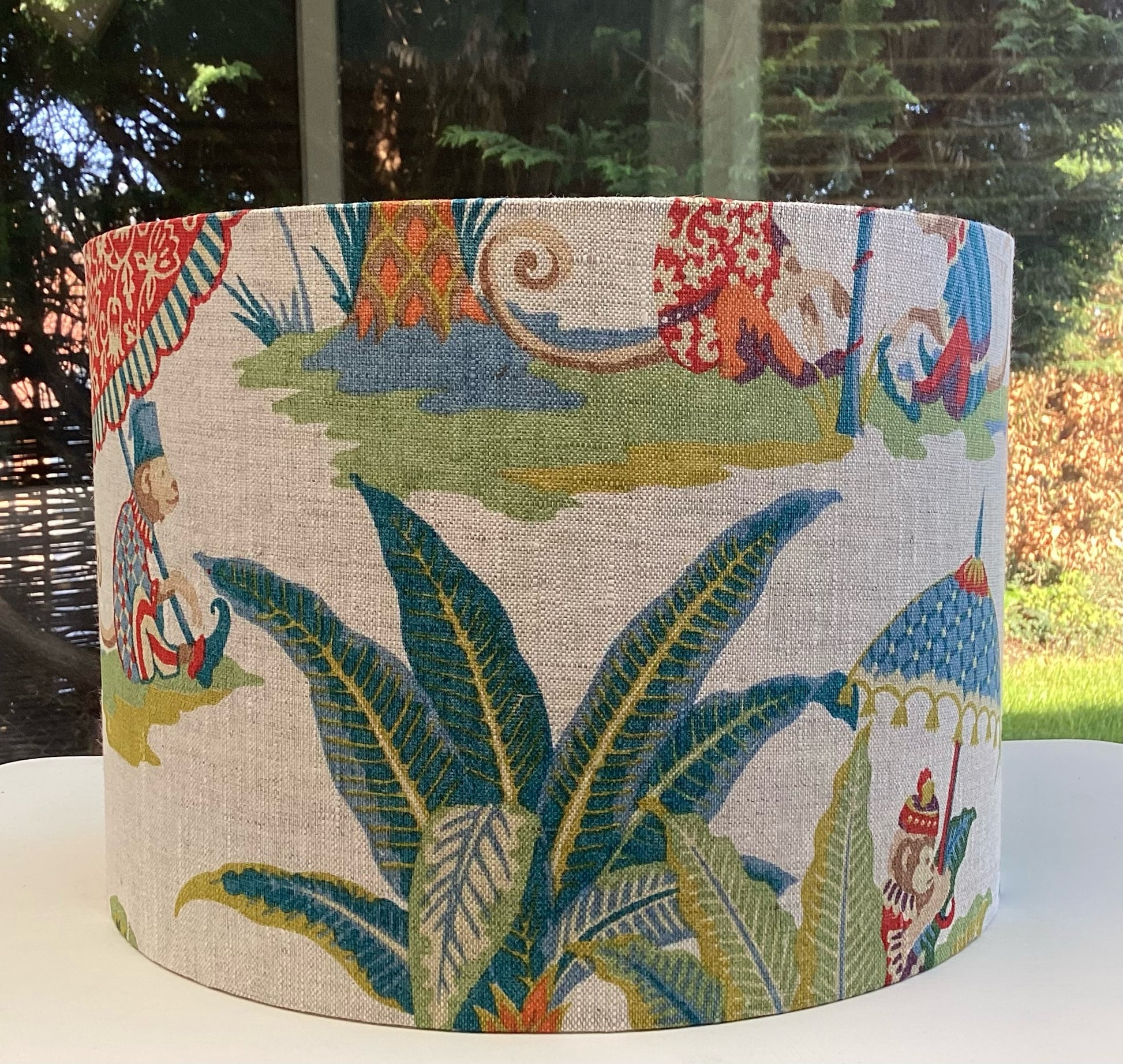 A playful lampshade featuring a cheerful monkey motif, perfect for adding whimsy to any space.