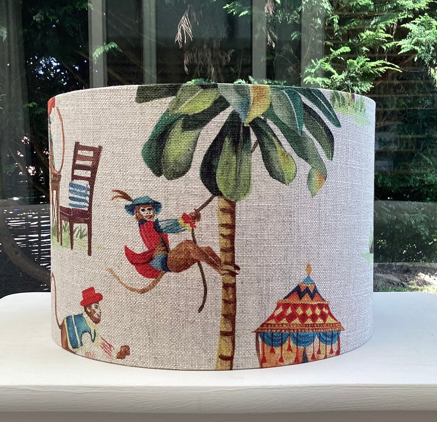 A playful lampshade featuring a cheerful monkey motif, perfect for adding whimsy to any space.