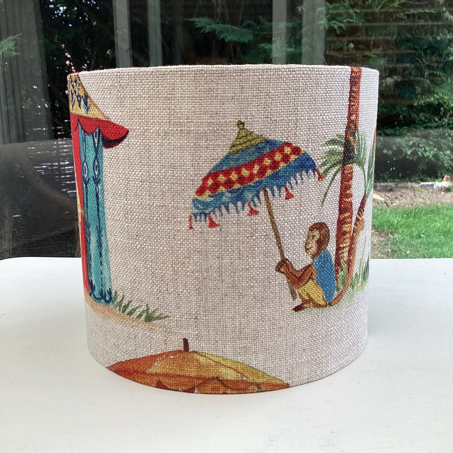 A playful lampshade featuring a cheerful monkey motif, perfect for adding whimsy to any space.