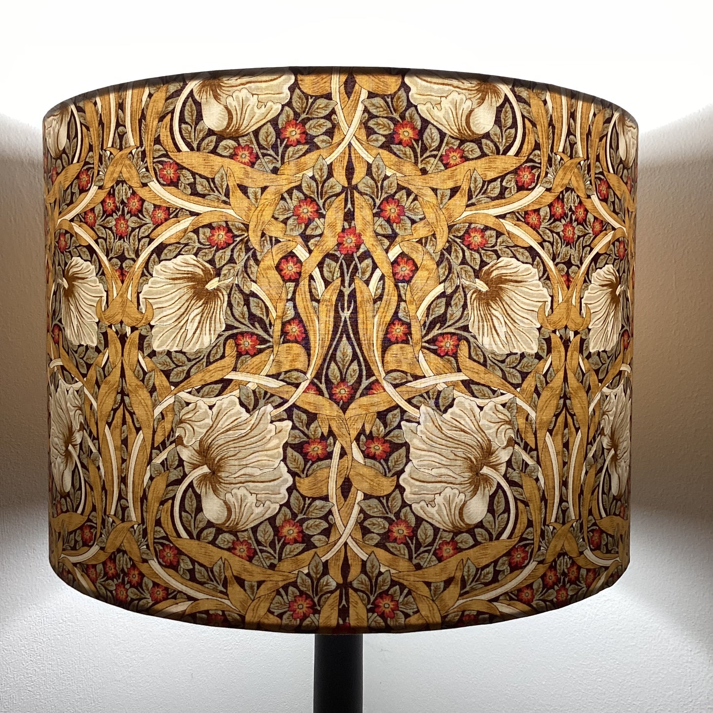 Explore the Pimpernel Aubergine lampshade, a sophisticated blend of rich purple tones and intricate floral patterns. Perfect for adding elegance and charm to your home decor, this handcrafted piece enhances any interior style with timeless beauty.