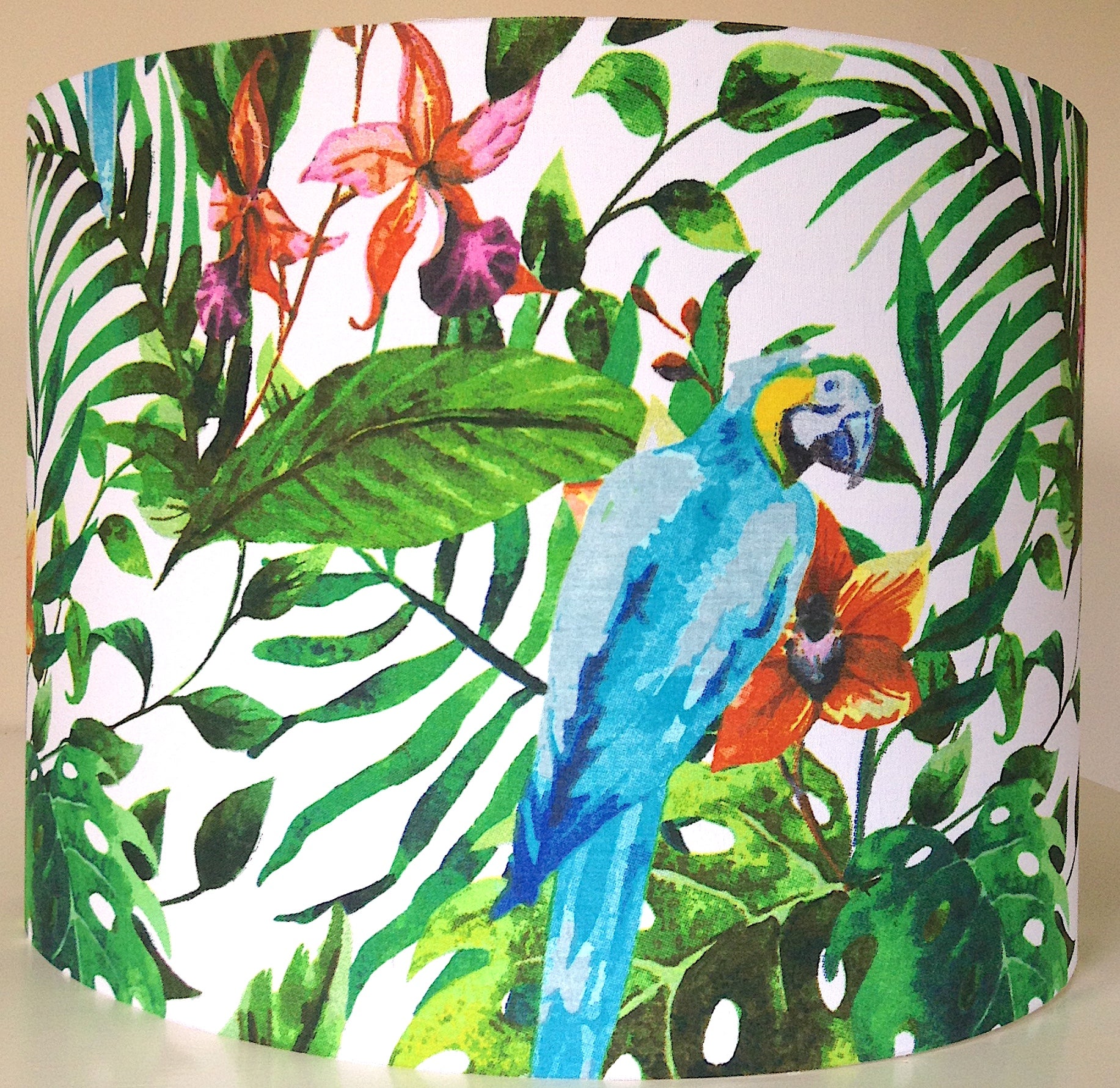 Tropical lampshade with vibrant parrots and green foliage, ideal for adding exotic flair to home decor – handcrafted and unique lighting accessory.