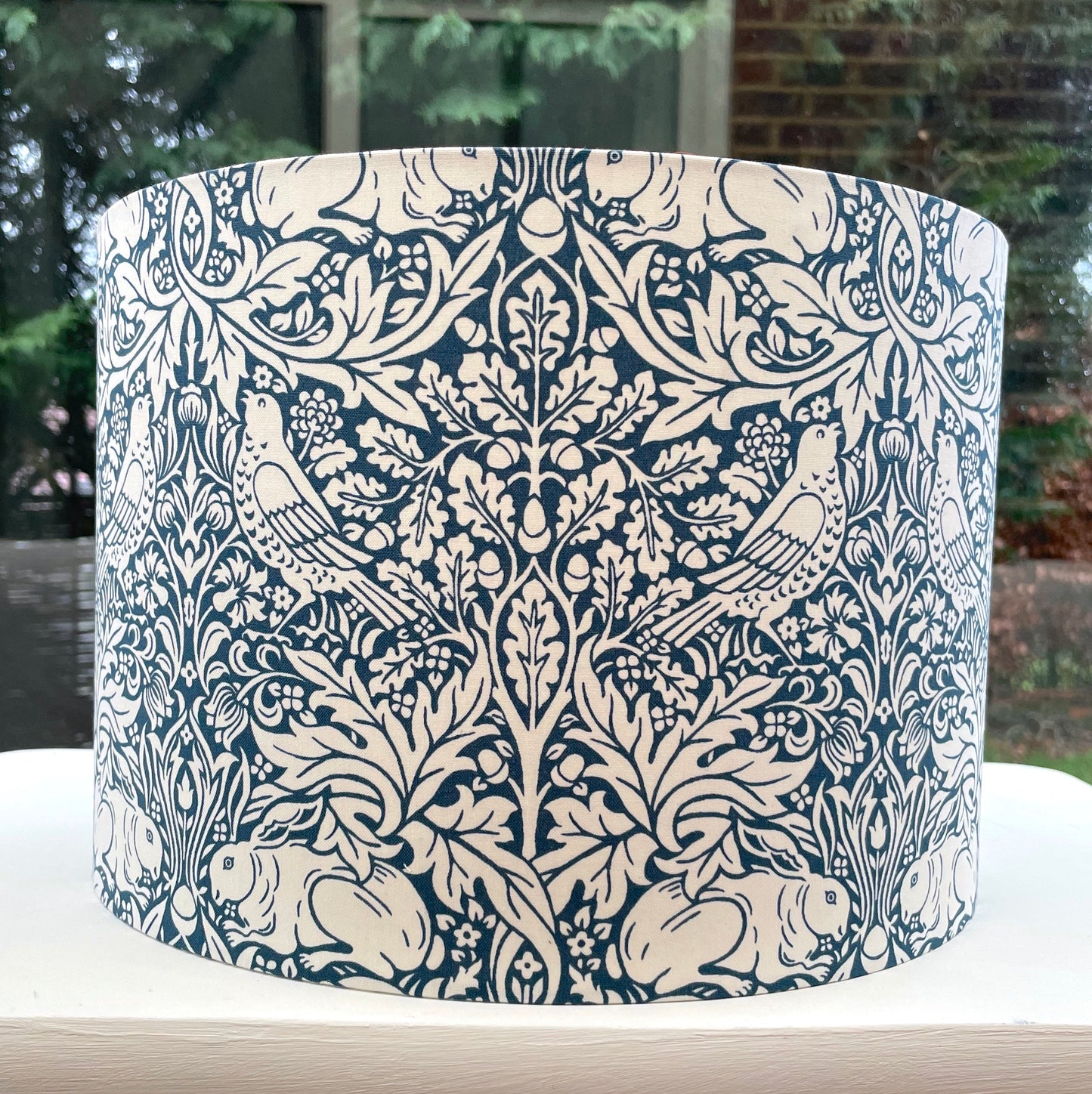 William Morris Brer Rabbit lampshade in navy blue with detailed floral and animal motifs, perfect for adding a vintage, artistic touch to any room.