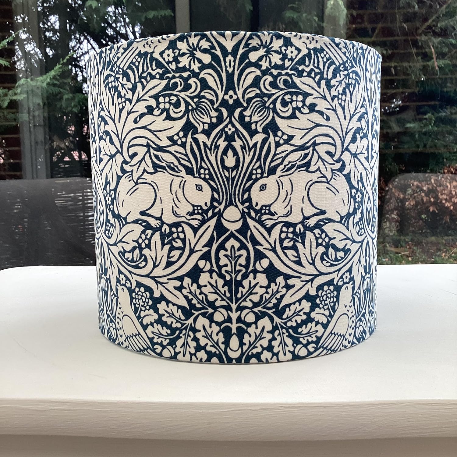 William Morris Brer Rabbit lampshade in navy blue with detailed floral and animal motifs, perfect for adding a vintage, artistic touch to any room.