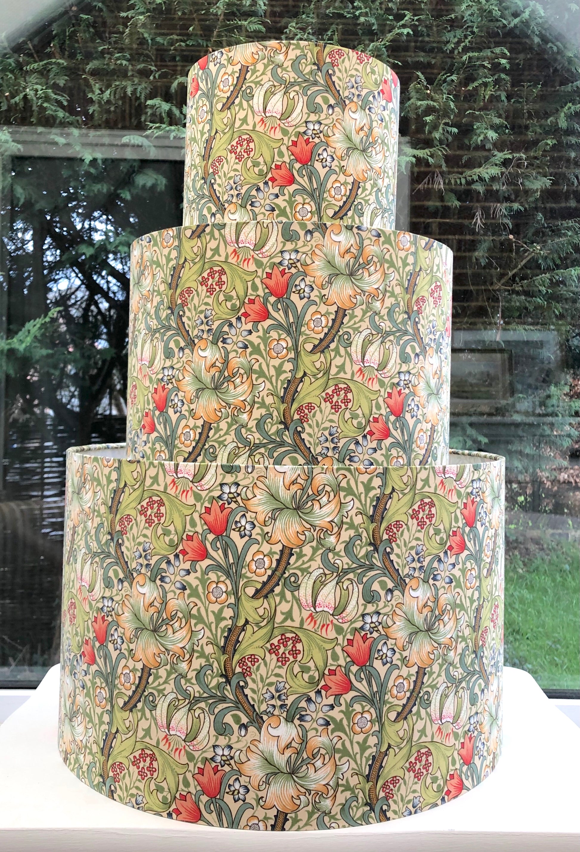 William Morris Golden Lily lampshade featuring a rich, vintage floral design with golden hues, perfect for adding a touch of classic elegance to any room decor.