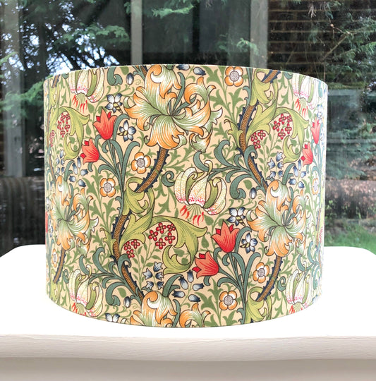 William Morris Golden Lily lampshade featuring a rich, vintage floral design with golden hues, perfect for adding a touch of classic elegance to any room decor.