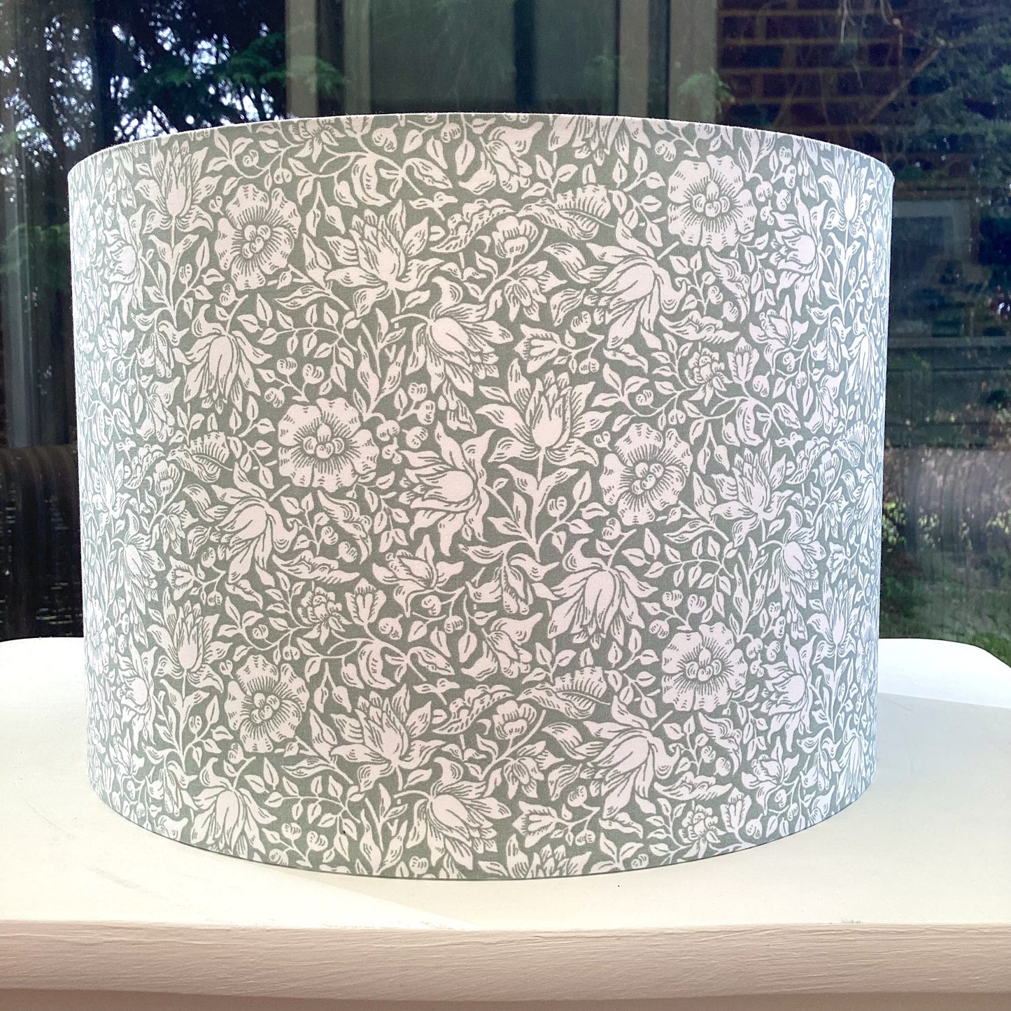 Handcrafted William Morris Mallow Sage lampshade with a timeless botanical design, perfect for adding vintage charm and sophistication to your home decor.