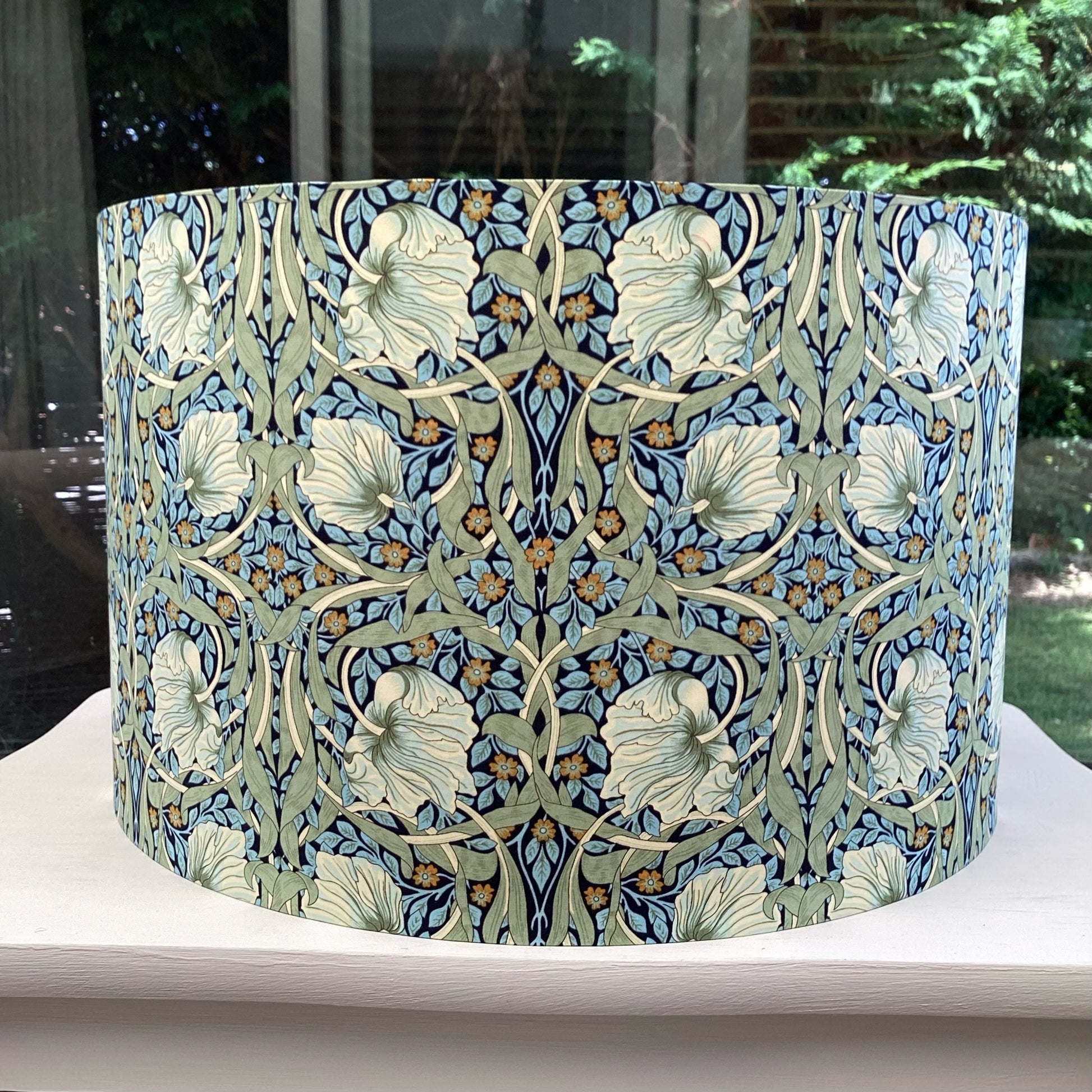 William Morris Pimpernel lampshade in blue and green, showcasing intricate floral patterns, perfect for vintage and artisan-style home decor. Handcrafted luxury lighting accent for any room.