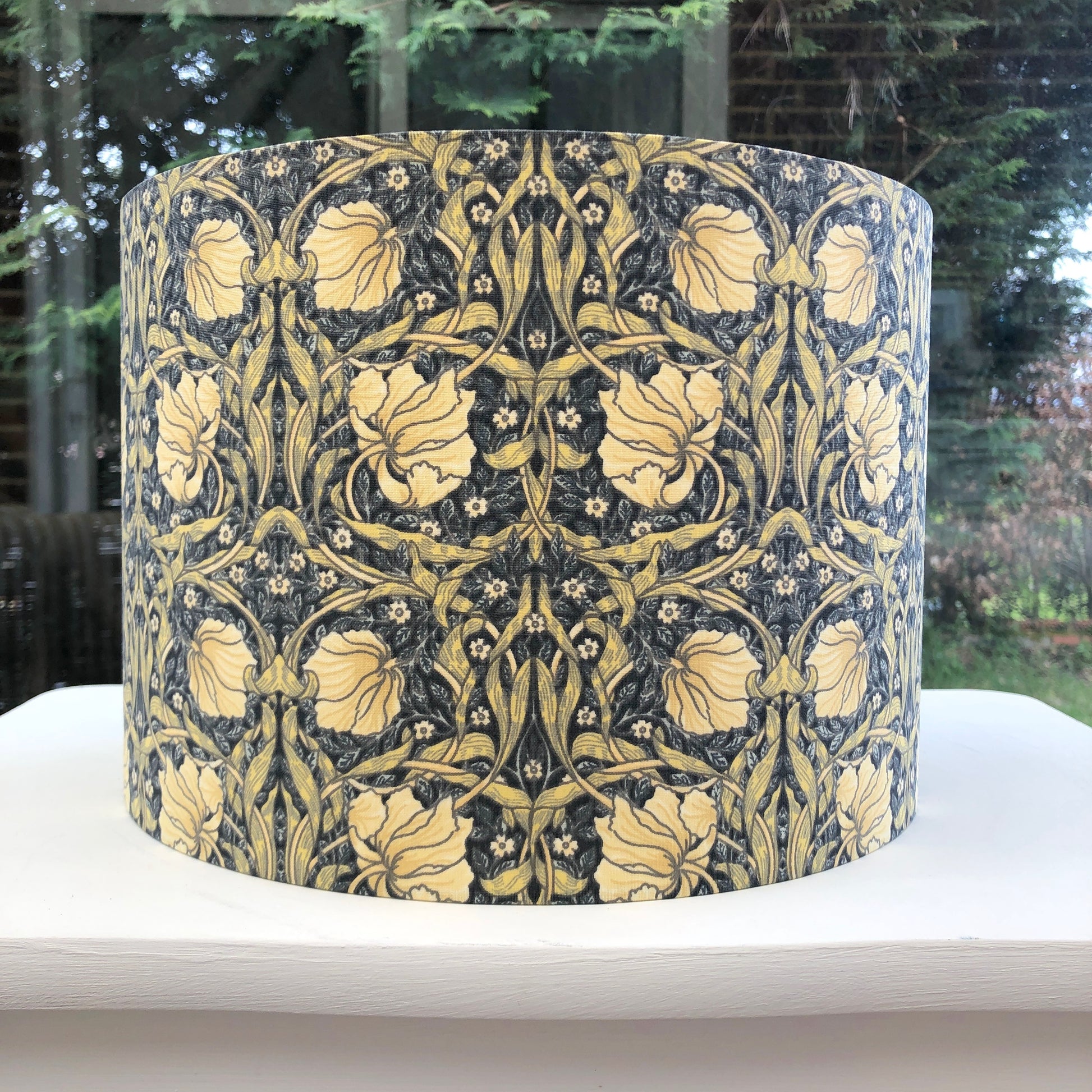 William Morris Pimpernel Lampshade in Cream and Charcoal Grey, featuring intricate floral and botanical patterns. Perfect for vintage-inspired or modern interiors, this handcrafted lampshade adds elegance and charm to any room decor.