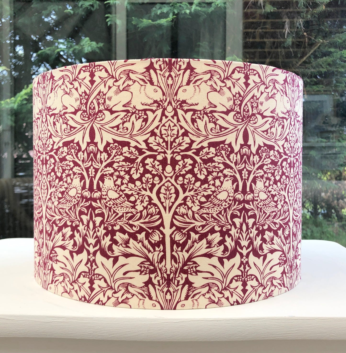 William Morris red lampshade featuring the iconic 'Brer Rabbit' pattern, handcrafted with premium materials for a timeless vintage aesthetic, perfect for enhancing traditional and modern interiors.