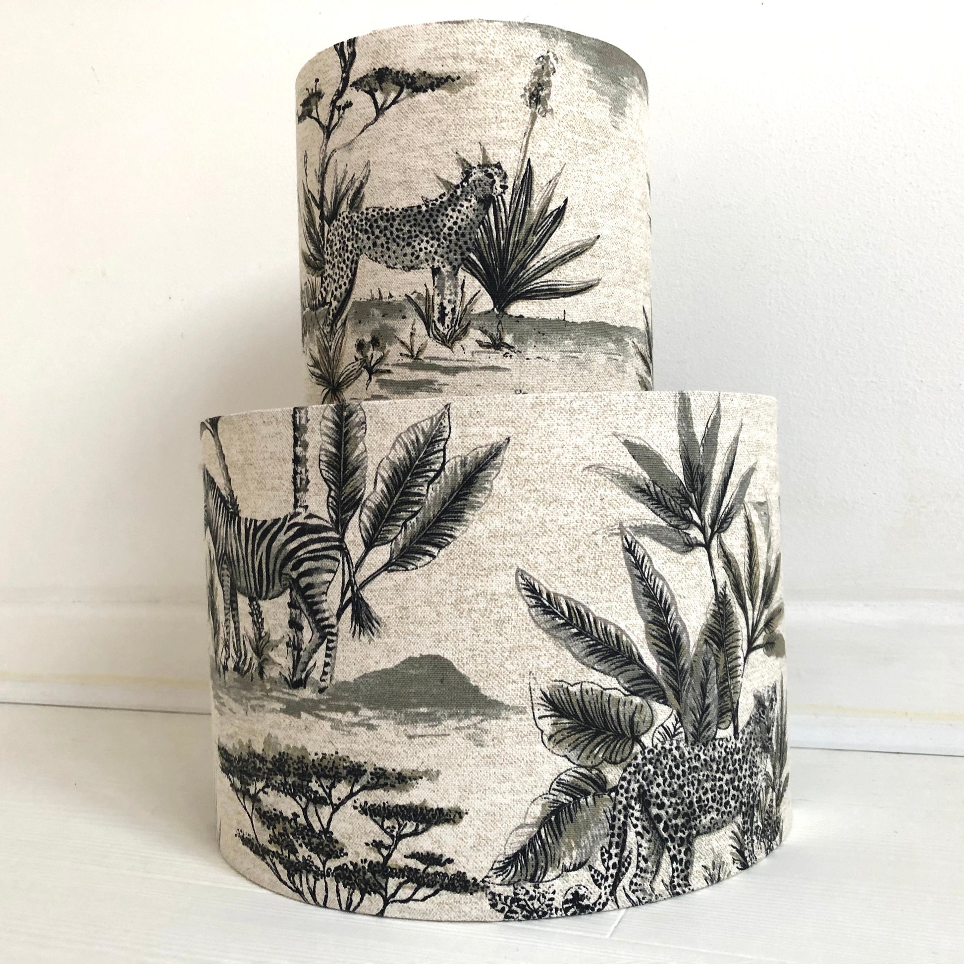 African safari-themed lampshade with vibrant animal and landscape motifs, perfect for adding a touch of exotic style and warmth to home decor.