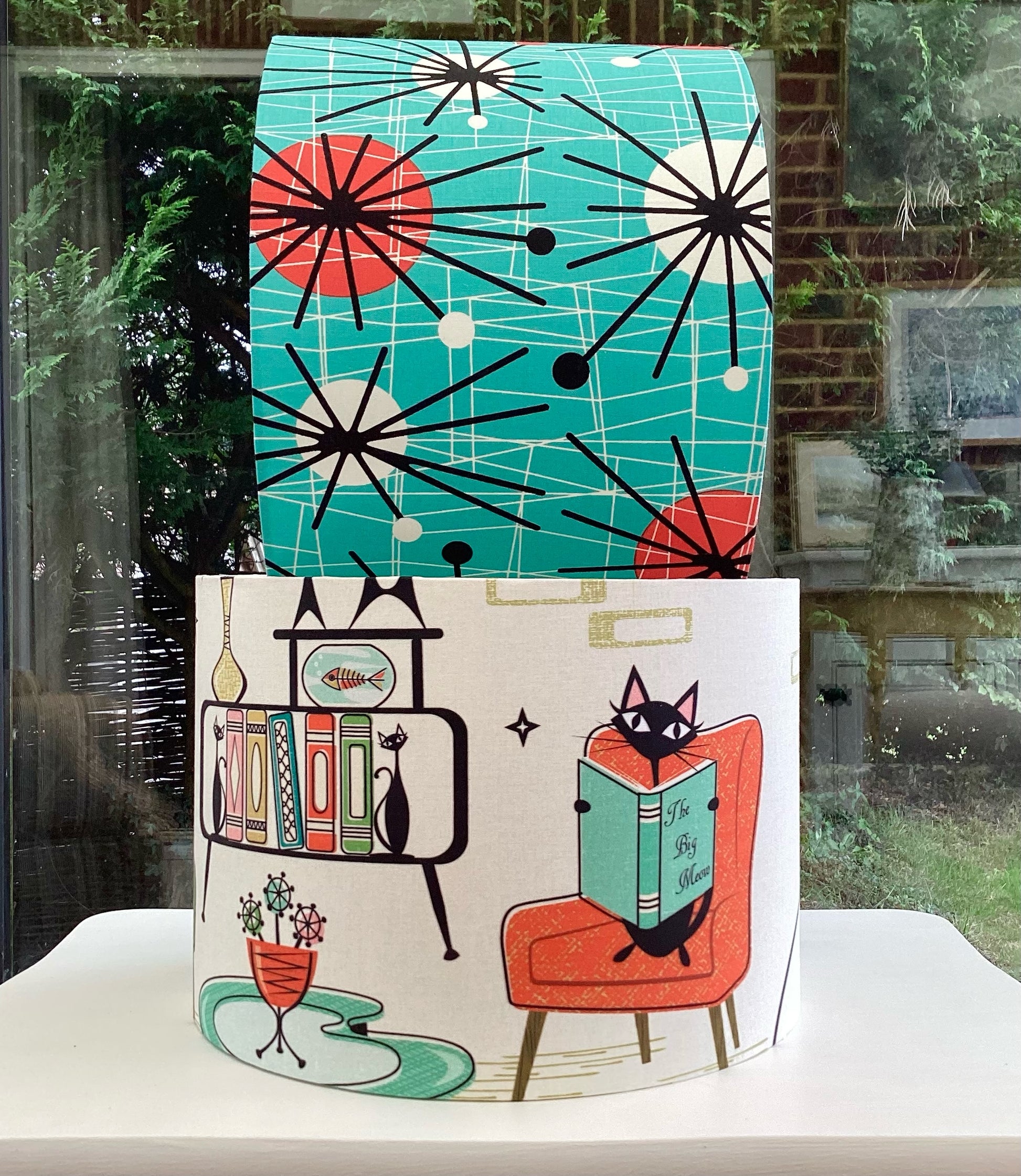 Atomic Kitten teal lampshade with retro-inspired geometric design, perfect for adding a bold, stylish accent to modern home interiors.