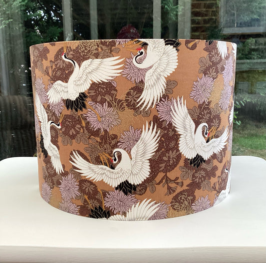 Beautiful brown lampshade adorned with a delicate crane design, showcasing intricate details and a nature-inspired aesthetic perfect for elegant home decor.