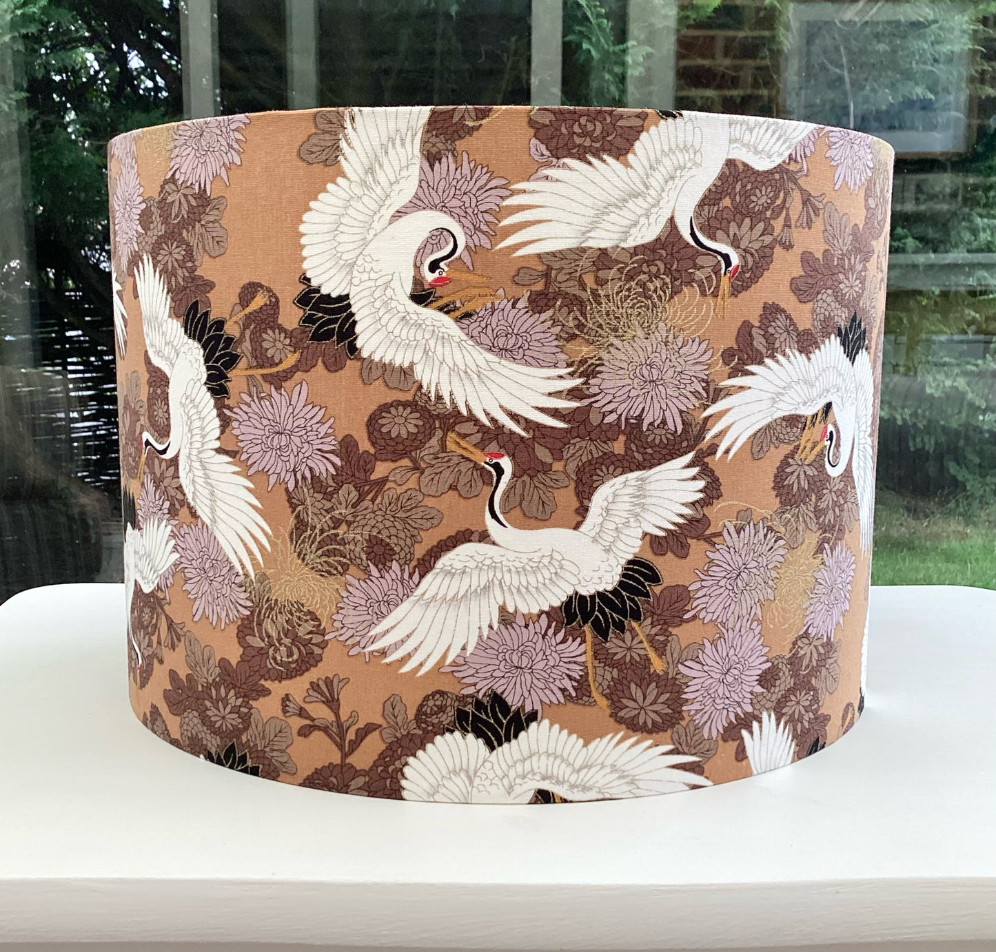 Beautiful brown lampshade adorned with a delicate crane design, showcasing intricate details and a nature-inspired aesthetic perfect for elegant home decor.