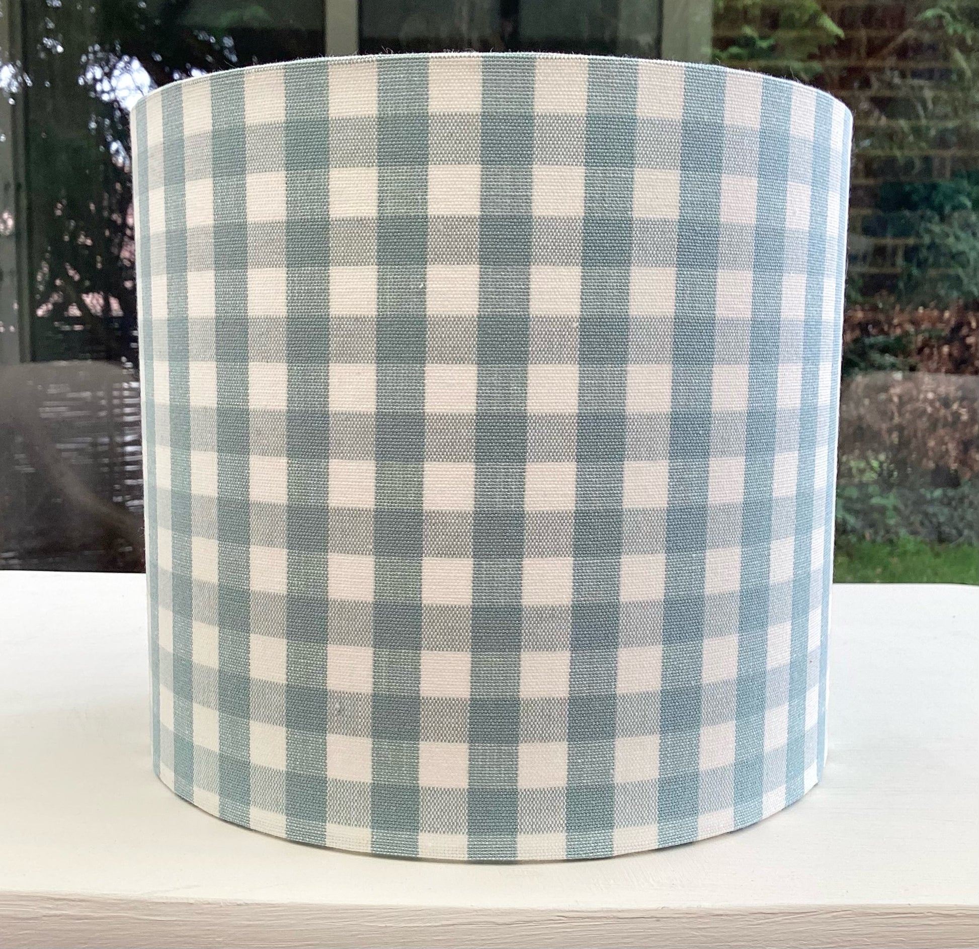 Duckegg blue coloured gingham-patterned lampshade, adding a touch of rustic charm to any space.