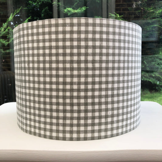 Handcrafted green gingham lampshade with a classic checkered pattern, perfect for adding a vintage touch to home decor.