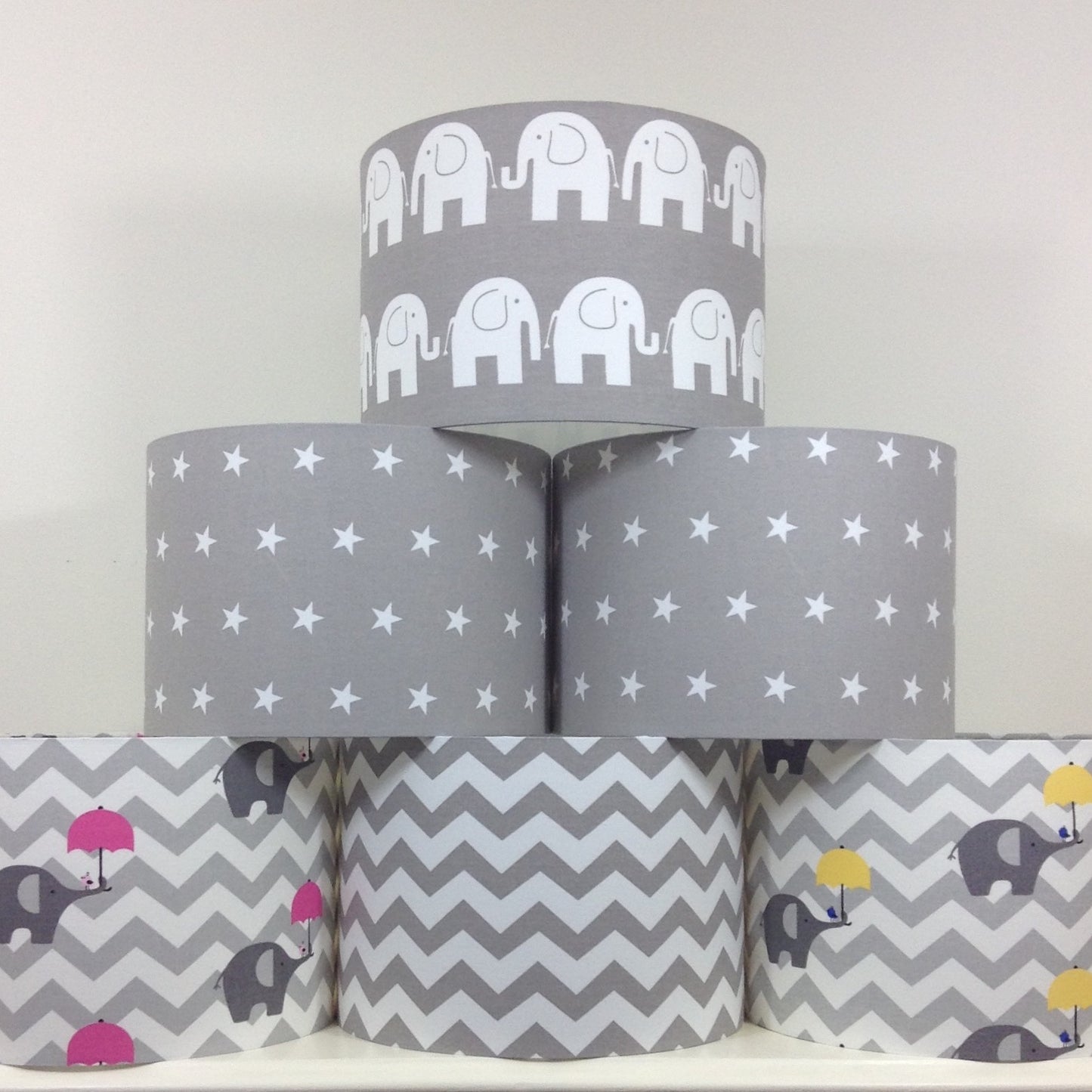 Modern grey lampshade with stars motif, adding contemporary flair to any space.