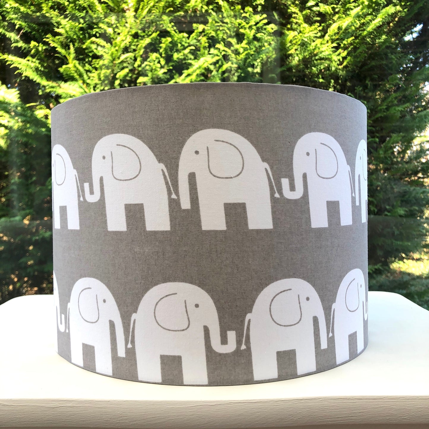 Modern grey lampshade with a elephant motif, adding contemporary flair to any space.