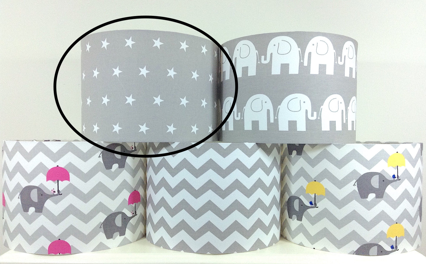 Modern grey lampshade with stars motif, adding contemporary flair to any space.