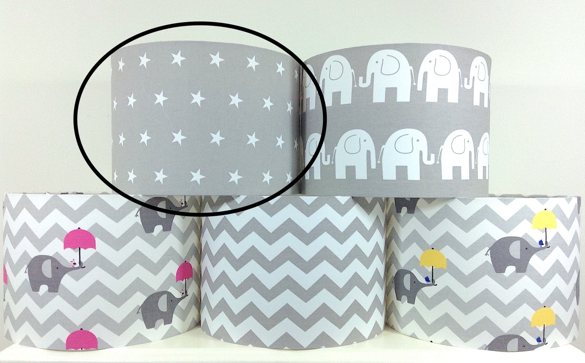 Modern grey lampshade with stars motif, adding contemporary flair to any space.