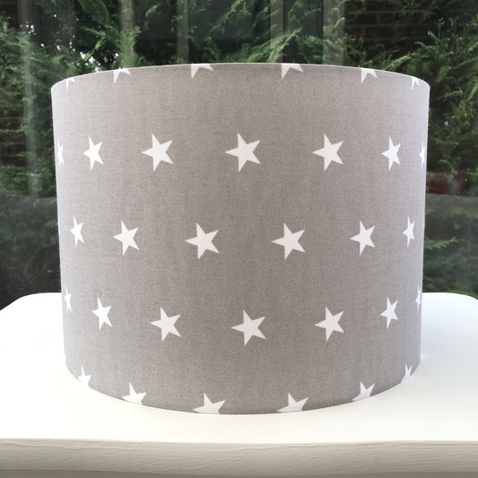 Modern grey lampshade with stars motif, adding contemporary flair to any space.