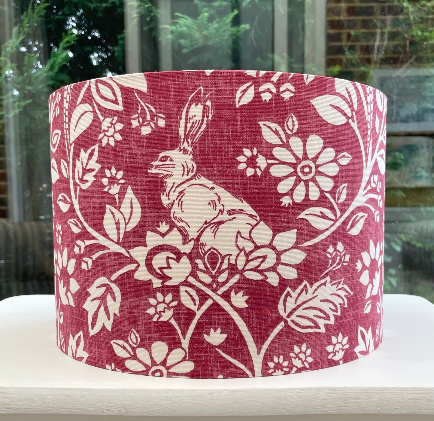 Handcrafted Heathland Rabbit lampshade in Peacock Ruby Red with intricate floral and animal patterns, perfect for adding a touch of elegance and color to your home decor.