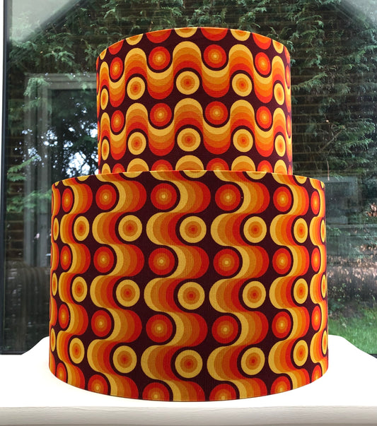 Colorful retro-inspired lampshade with bold geometric patterns, reminiscent of 1960s design aesthetics.