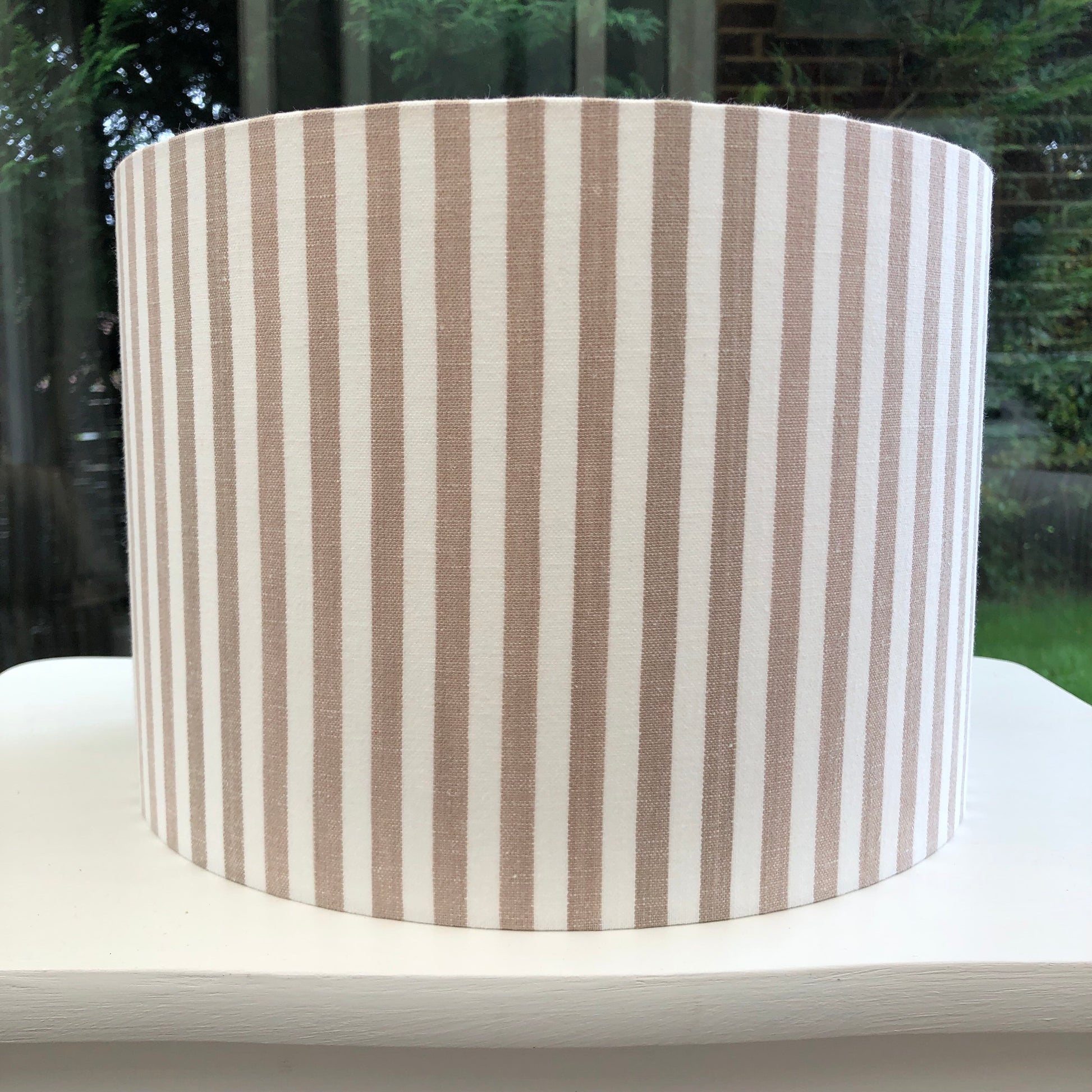 Handcrafted linen striped lampshade in neutral tones, perfect for modern and minimalist home decor. High-quality fabric with subtle texture, ideal for enhancing lighting and adding style to any room.