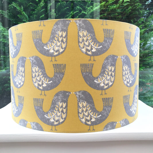 Scandinavian-inspired lampshade featuring a charming bird pattern against a soft pastel background.