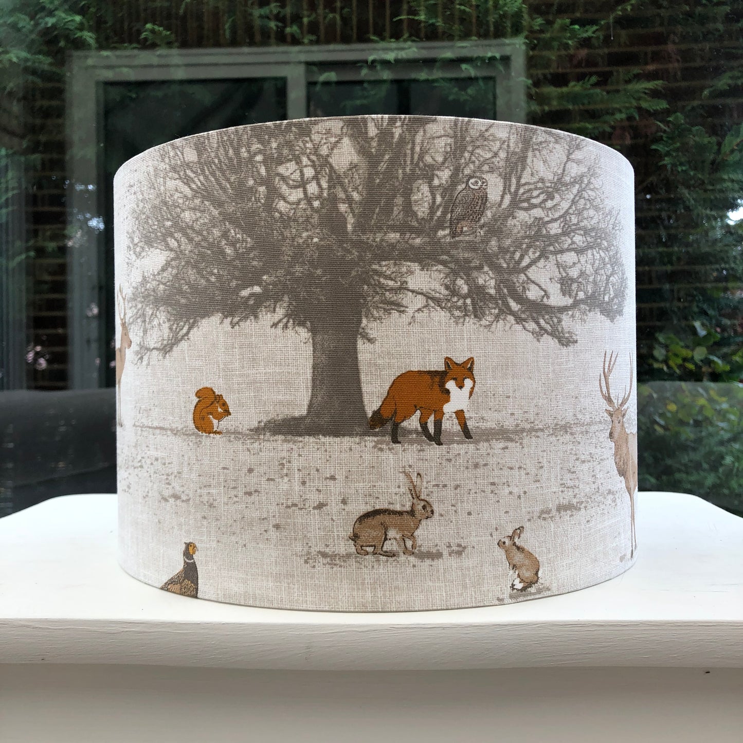 Handcrafted Tatton Woodland Wildlife lampshade featuring a detailed nature-inspired design with woodland animals, perfect for rustic and nature-themed decor.