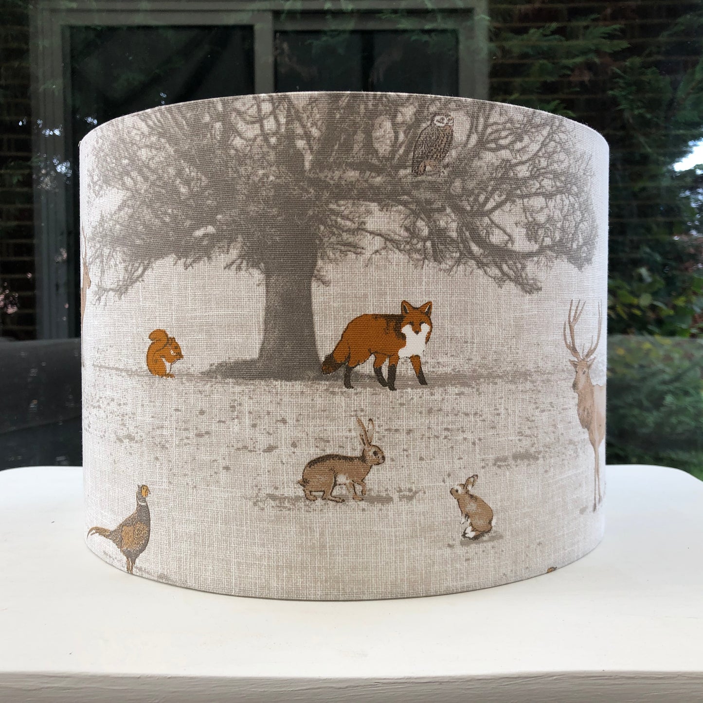 Handcrafted Tatton Woodland Wildlife lampshade featuring a detailed nature-inspired design with woodland animals, perfect for rustic and nature-themed decor.