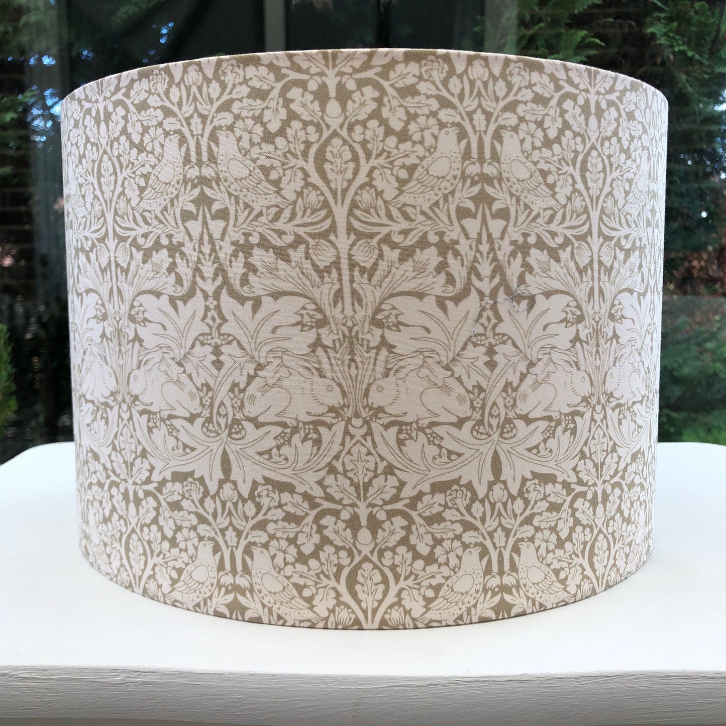 Olive green lampshade featuring charming Brer Rabbit print, perfect for adding whimsical flair to any space.