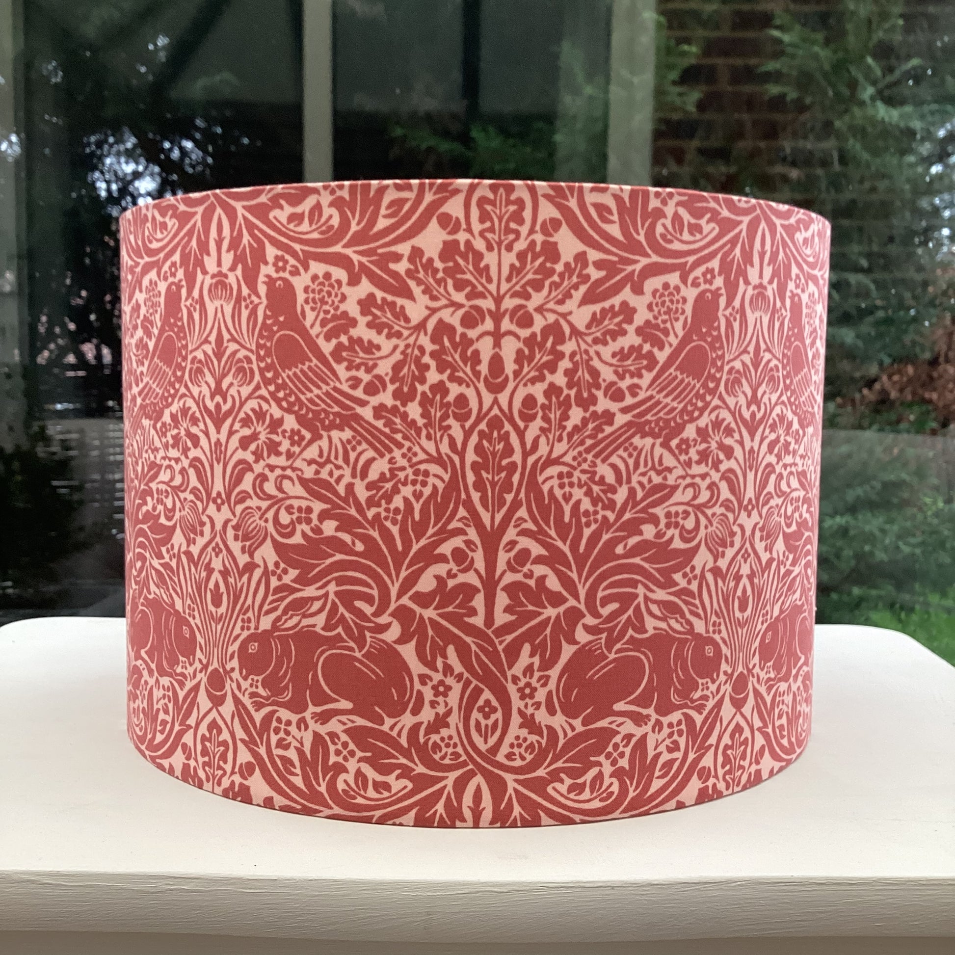 Red lampshade featuring charming Brer Rabbit motif, adding whimsical flair to any space.