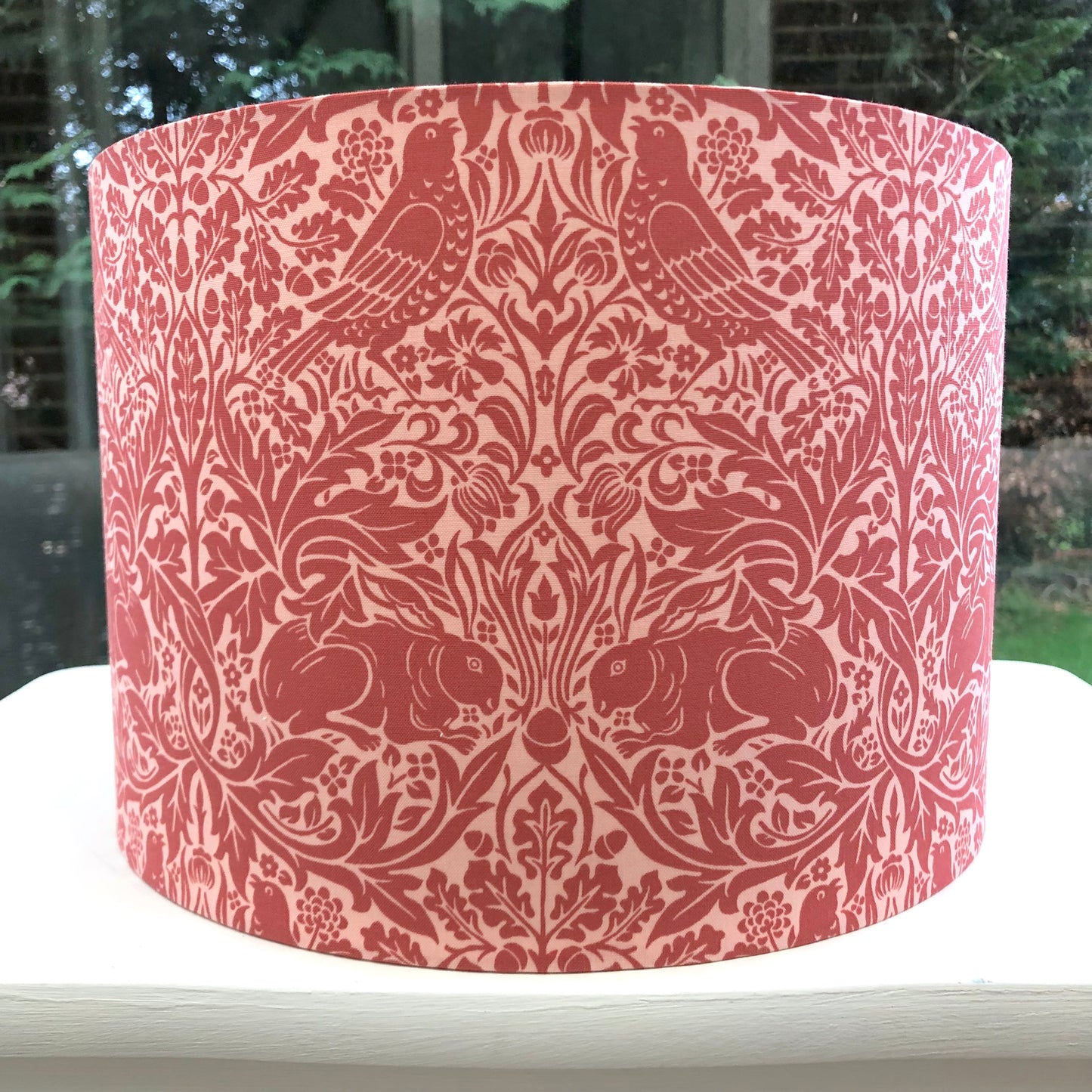 Red lampshade featuring charming Brer Rabbit motif, adding whimsical flair to any space.