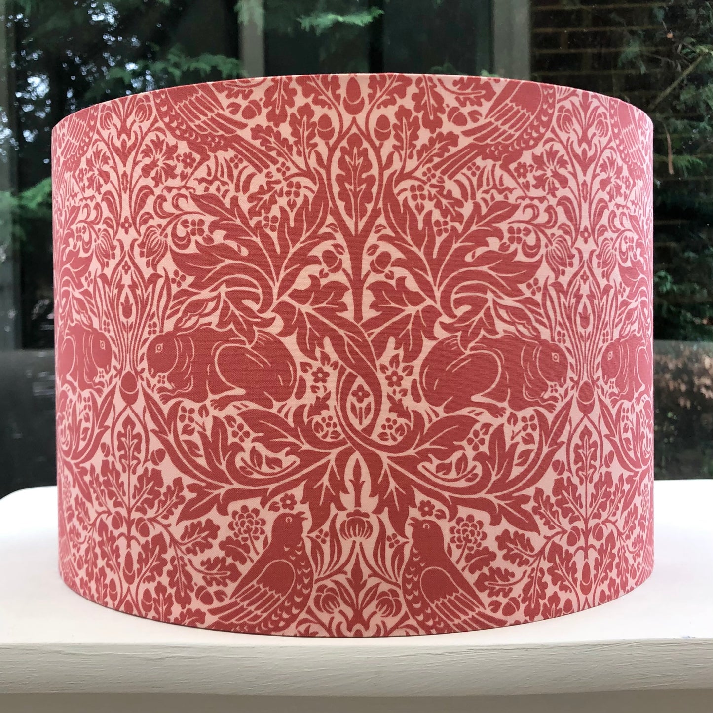 Red lampshade featuring charming Brer Rabbit motif, adding whimsical flair to any space.