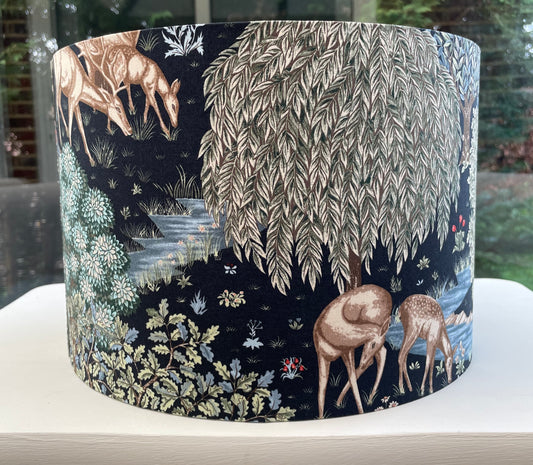 Forest-themed lampshade featuring intricate tree silhouettes against a dark background, evoking a serene woodland ambiance.