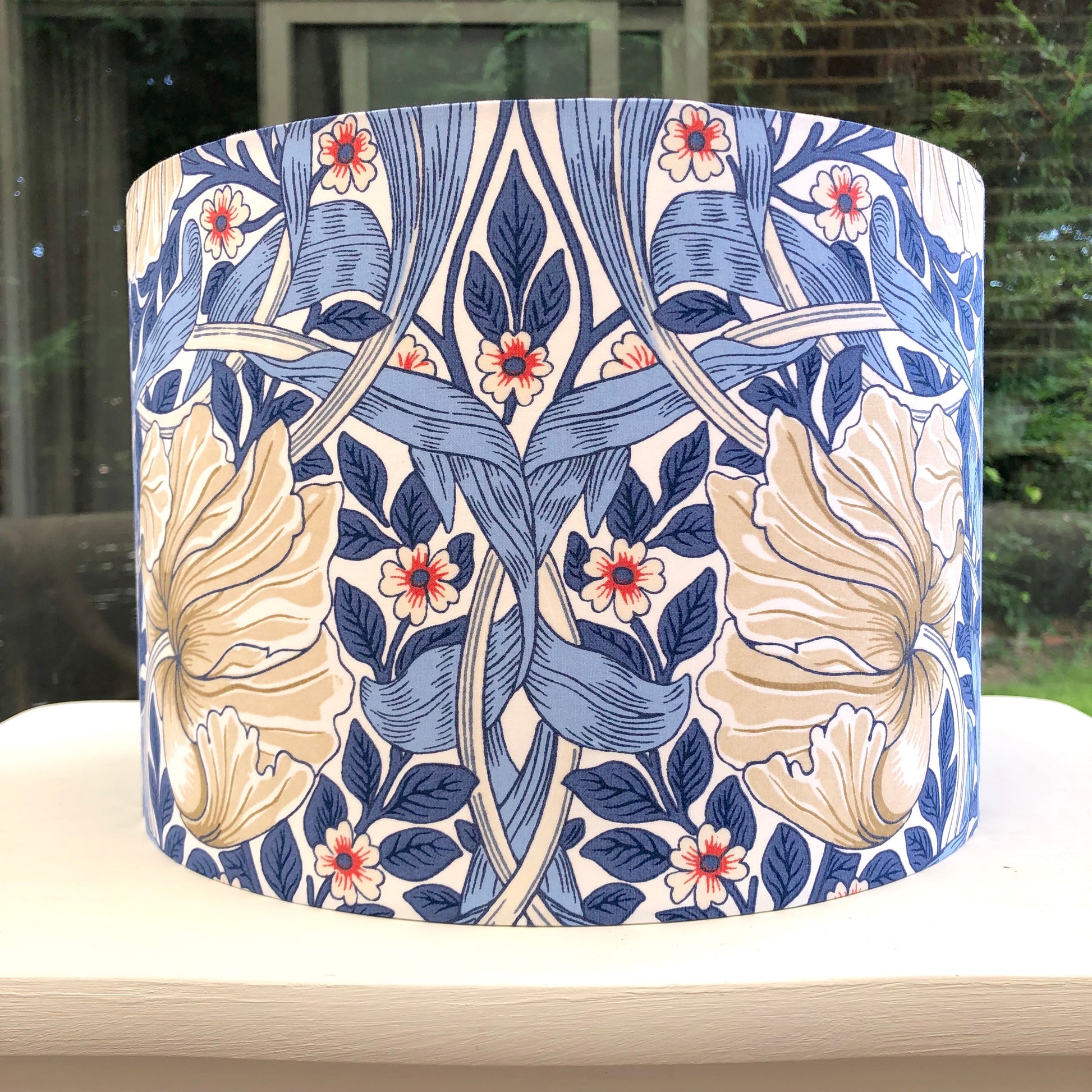 Blue floral-patterned lampshade, bringing a touch of nature-inspired charm to any space.