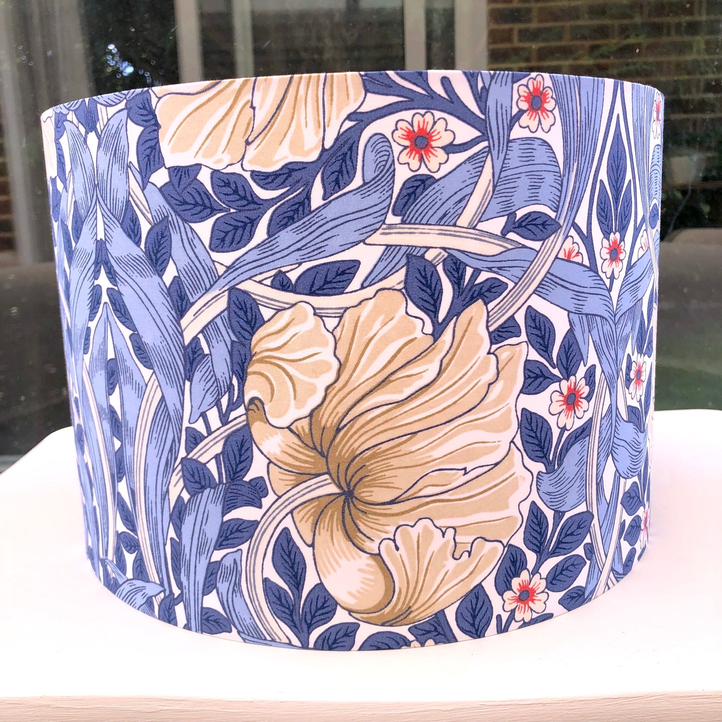 Blue floral-patterned lampshade, bringing a touch of nature-inspired charm to any space.