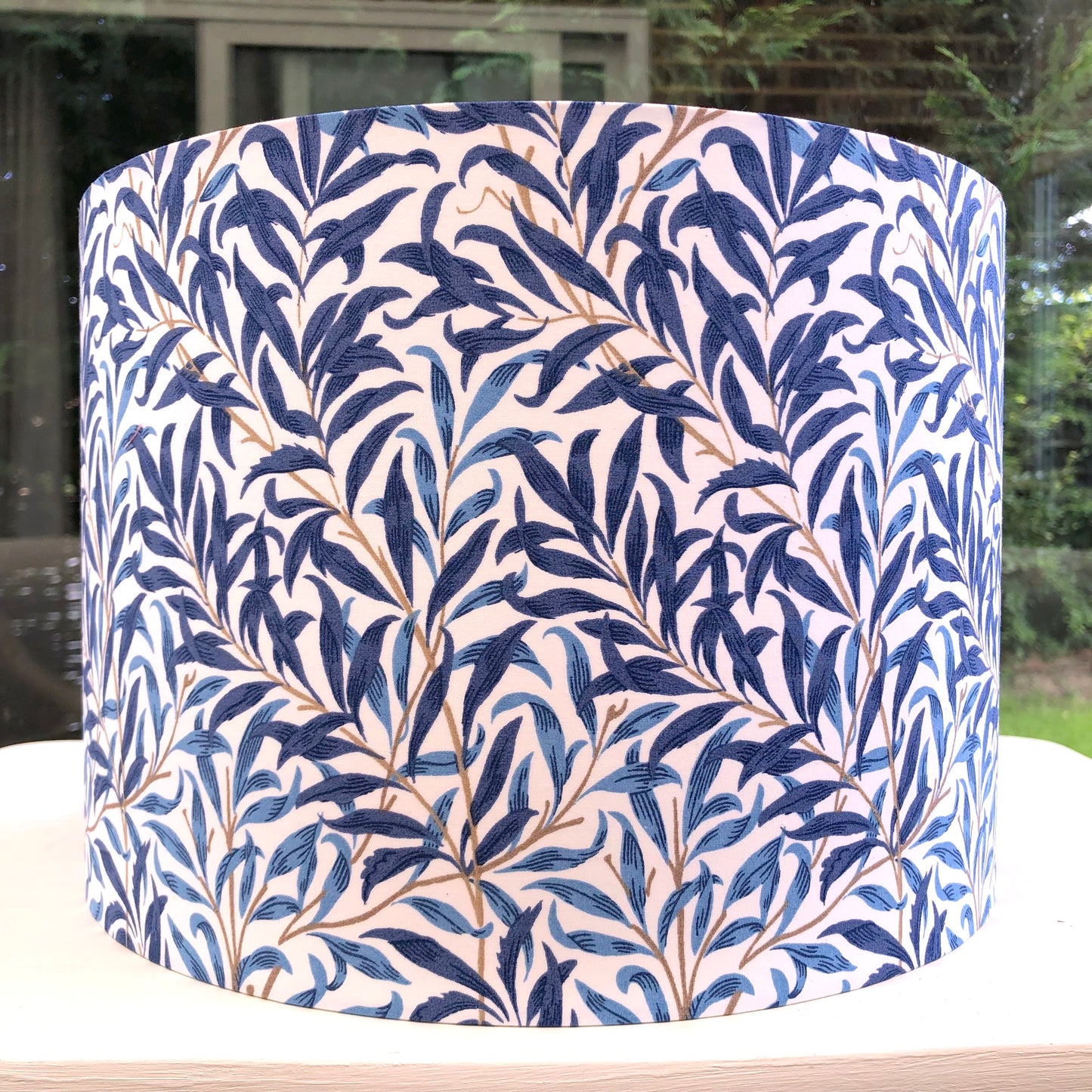 Blue lampshade featuring a delicate willow bough pattern, offering a serene and nature-inspired ambiance.