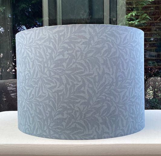 Slate blue lampshade featuring a delicate willow bough pattern, offering a serene and nature-inspired ambiance.