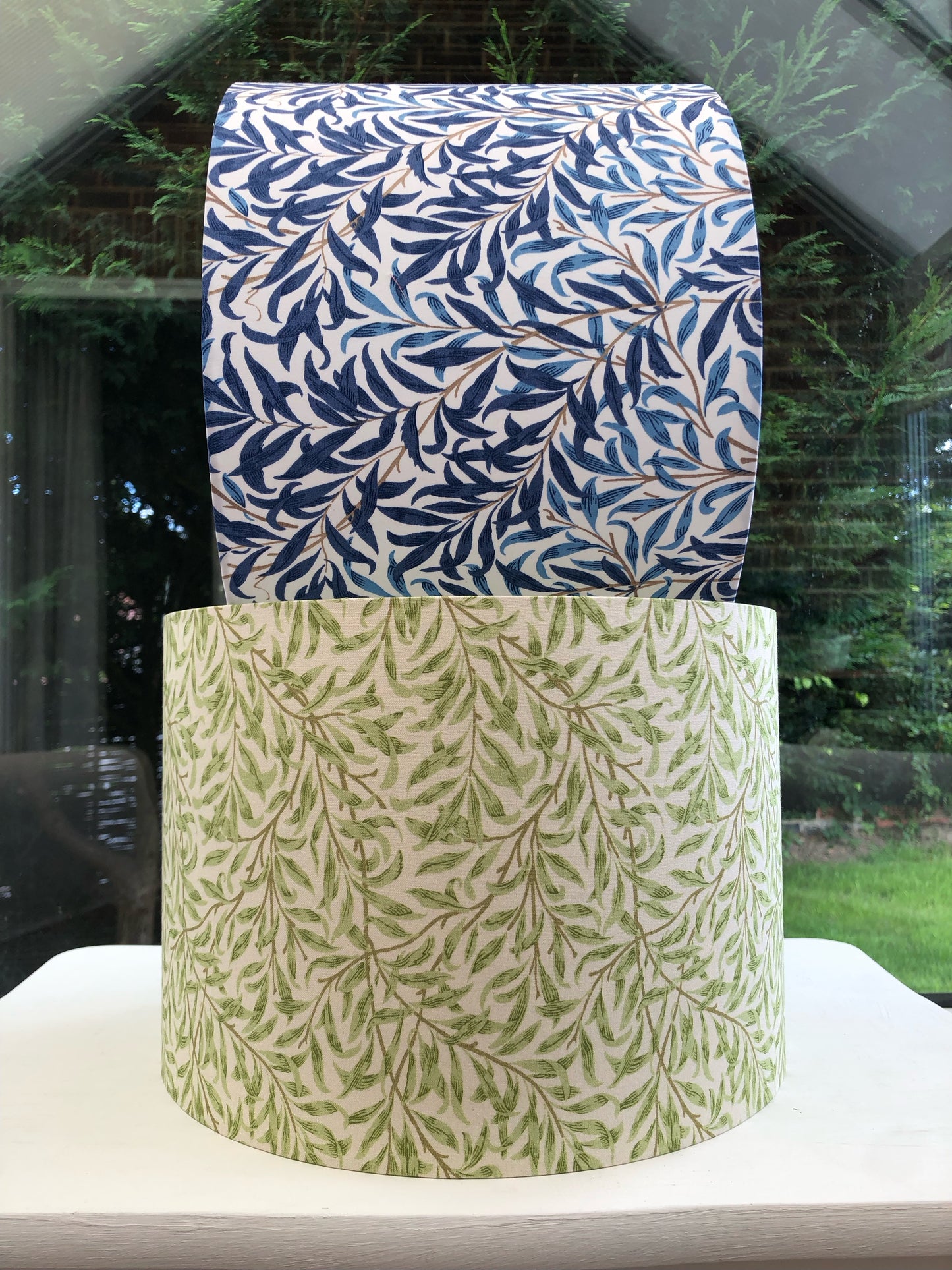 Green coloured lampshade featuring a delicate willow bough pattern, offering a serene and nature-inspired ambiance.