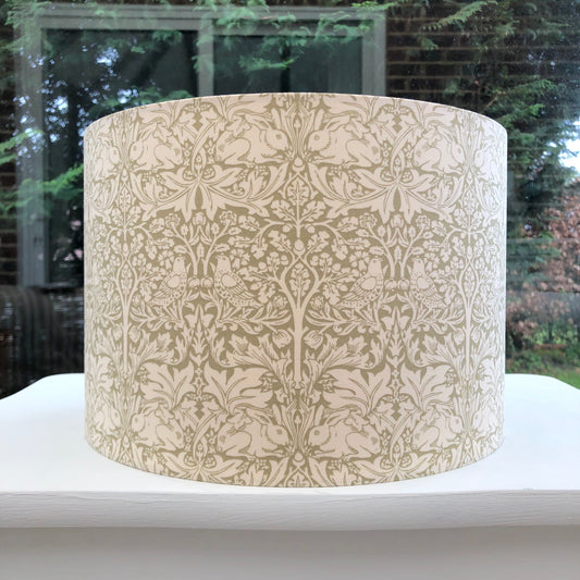 William Morris Brer Rabbit Sage lampshade in a timeless botanical print, featuring intricate green and cream patterns, perfect for adding a touch of classic elegance to any interior design.