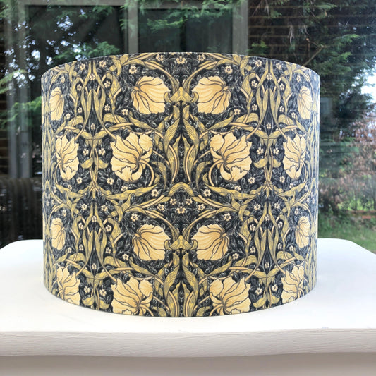 William Morris Pimpernel Lampshade in Cream and Charcoal Grey, featuring intricate floral and botanical patterns. Perfect for vintage-inspired or modern interiors, this handcrafted lampshade adds elegance and charm to any room decor.