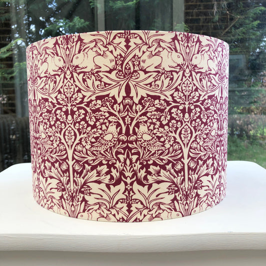 William Morris red lampshade featuring the iconic 'Brer Rabbit' pattern, handcrafted with premium materials for a timeless vintage aesthetic, perfect for enhancing traditional and modern interiors.