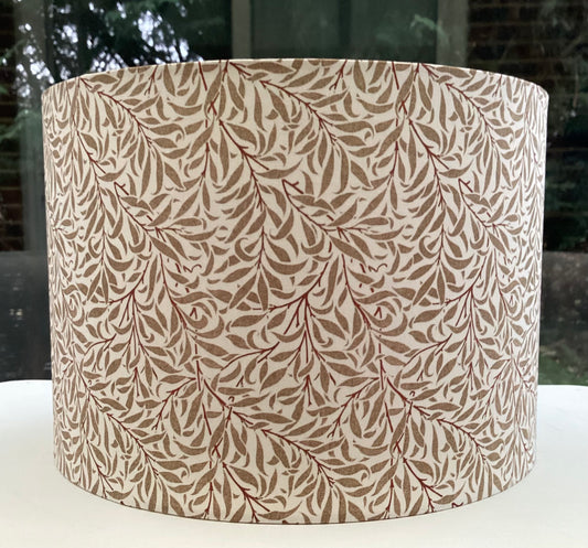 Cream gold coloured lampshade featuring a delicate willow bough pattern, offering a serene and nature-inspired ambiance.