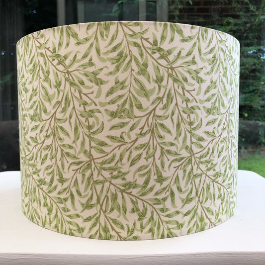 Green coloured lampshade featuring a delicate willow bough pattern, offering a serene and nature-inspired ambiance.